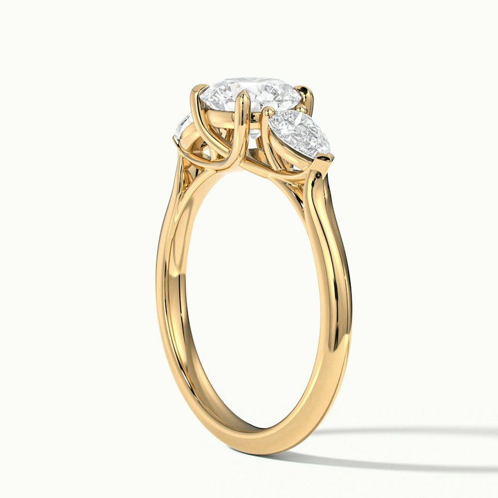Amaya 1.5 Carat Round 3 Stone Moissanite Diamond Ring With Pear Side Stone in 14k Yellow Gold
