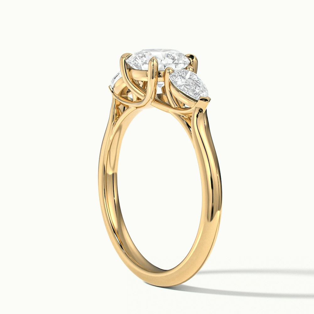 Amaya 2.5 Carat Round 3 Stone Moissanite Diamond Ring With Pear Side Stone in 10k Yellow Gold